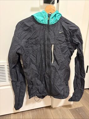 Nike Black Jacket with Teal Hood and Reflective Accents